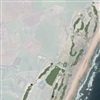 The New course (indicated with black flags) plays from the clubhouse down to the Southern Dome, for holes eight to fourteen among high natural dunes, before returning via four closing holes further inland. It is easy to see the potential for a compos