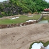The eighteenth hole plays downhill with water running across the front and to the left of the green (Photo: Nicklaus Design)