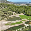 Holes have been routed around pine forests, mountains, sand dunes, lakes and marshland