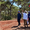 Brian Curley (centre) and Martin Moore (right) of Flagstick survey the site for the new course (Photo: Curley Golf Design)