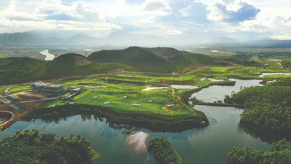 The practice range features bunkers at various distances and is located adjacent to the ninth hole, which plays back towards the clubhouse (Photo: Greg Norman Golf Course Design)
